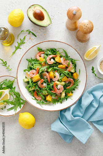 Shrimps salad with arugula, mango and avocado. Healthy food concept. Top view
