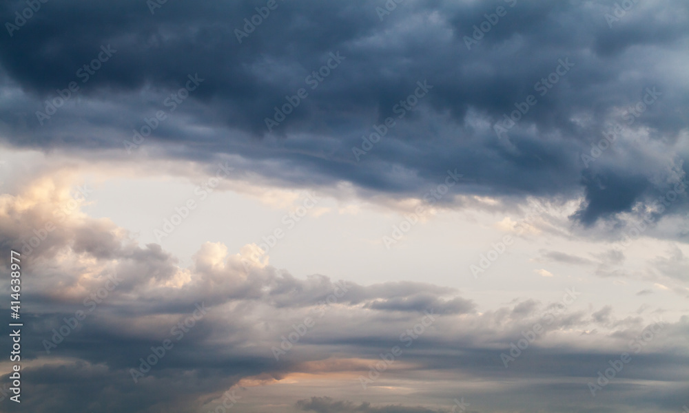 Dark cloudy tropical sky at sunset, natural background