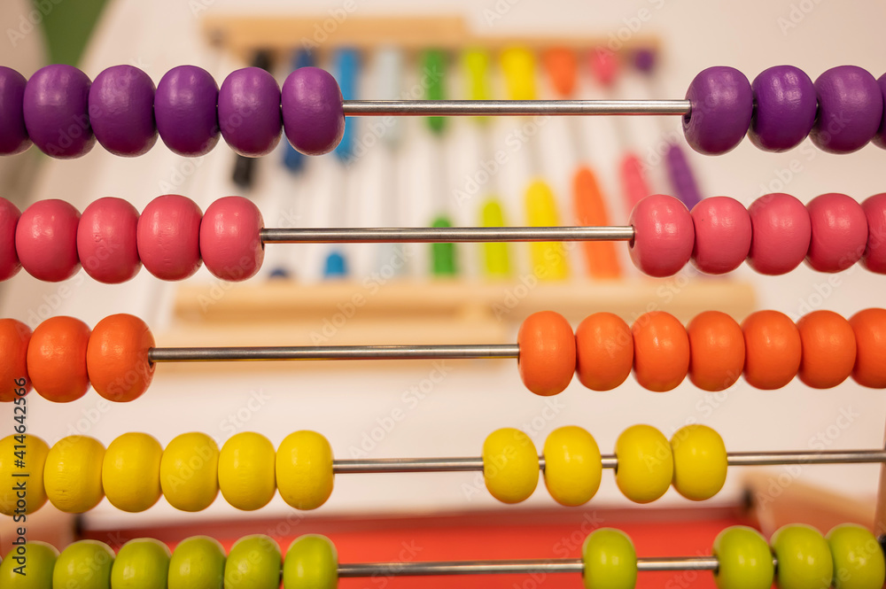 Bright colored hand abacus. Children's wooden toy for the study of arithmetic. Bright colored hand abacus. Children's wooden toy for the study of arithmetic.