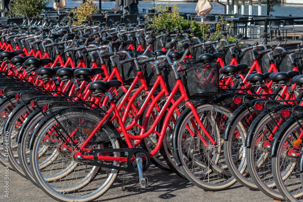 row of red bikes for bicycle sharing