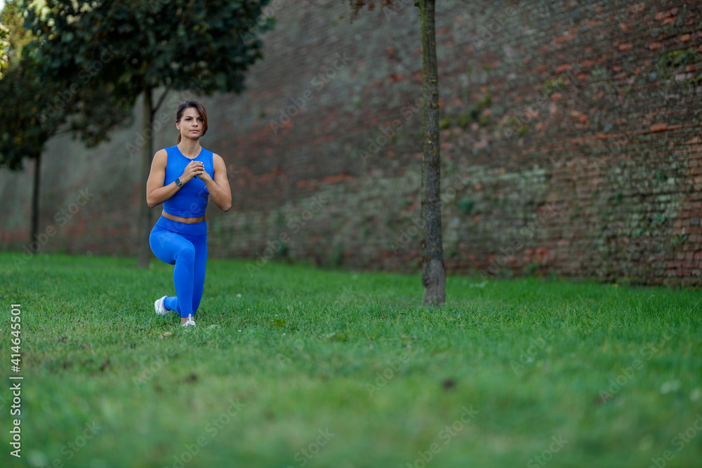Young athletic woman doing exercised outdoor Young athletic woman doing exercised outdoor