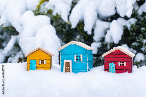 real estate concept colorful model houses in snow