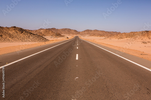 Road in the sahara desert of Egypt. Conceptual for freedom, enjoying the journey. Empty road. Freeway, Highway through the desert
