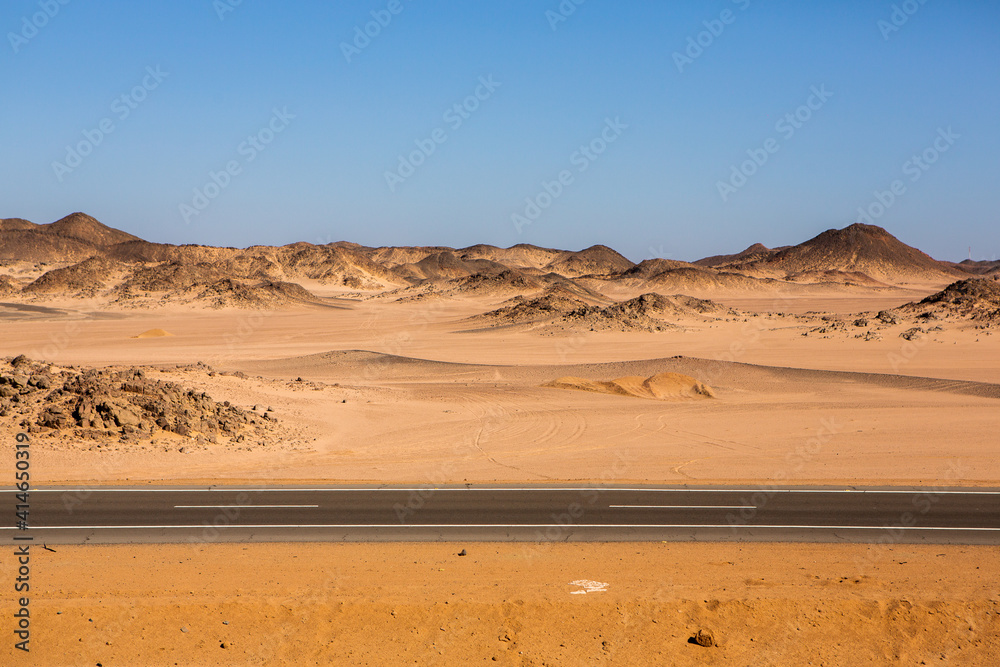 Road in the sahara desert of Egypt. Conceptual for freedom, enjoying the journey. Empty road. Freeway, Highway through the desert