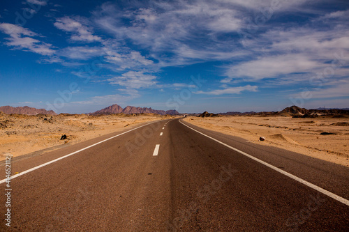 Road in the sahara desert of Egypt. Conceptual for freedom, enjoying the journey. Empty road. Freeway, Highway through the desert © romeof