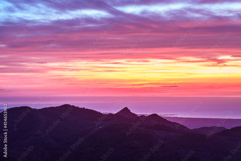 Colourful sunrise over the Spanish Mediterranean coast in La Plana Region.