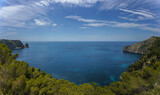 Panorama of the Spanish Mediterranean coast in the Region of Valencia with clean water, pine trees and some cliffs.