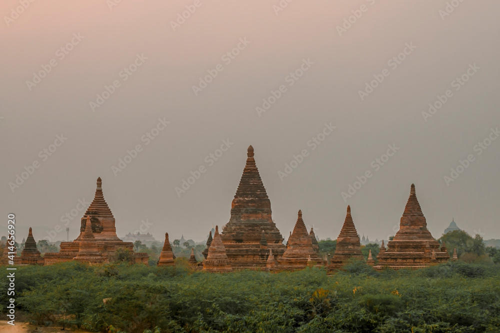 view of Pagodas and temples of Bagan, in Myanmar, formerly Burma, a world heritage site in amusty day during its sunrise