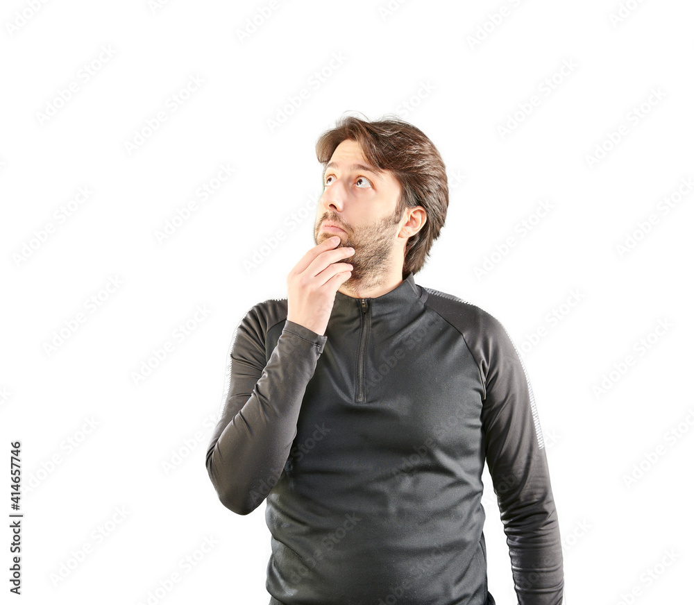 Long haired man is think and not decide and looking up, colorful background. Sportive clothes wearing style. Long haired man is think and not decide and looking up, colorful background. Sportive clothes wearing style.