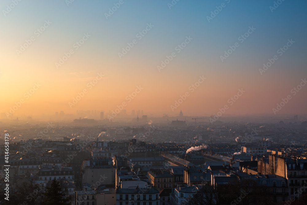 Polluted cityspace of Paris France in early morning with some fog