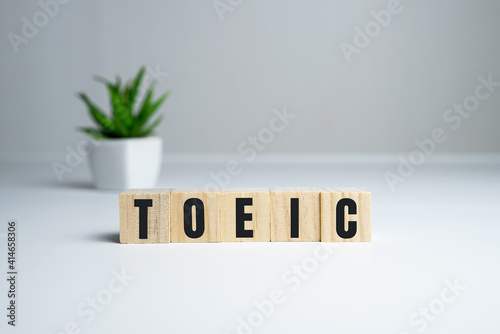 Toeic word on wooden cubes. Toeic concept photo