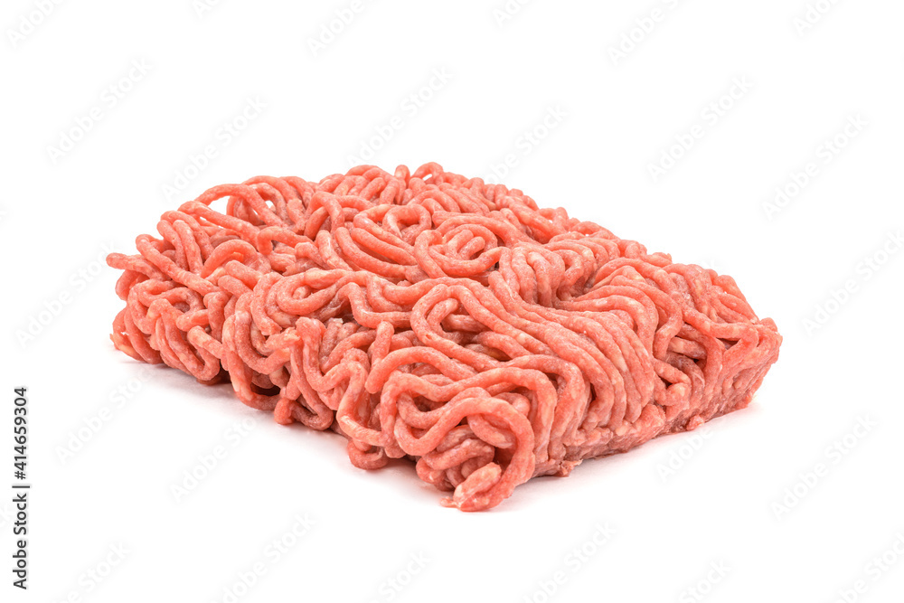 Fresh pork and beef minced meat, garnished with garlic, red pepper and dill.Isolated on a white background. Fresh pork and beef minced meat, garnished with garlic, red pepper and dill.Isolated on a white background.