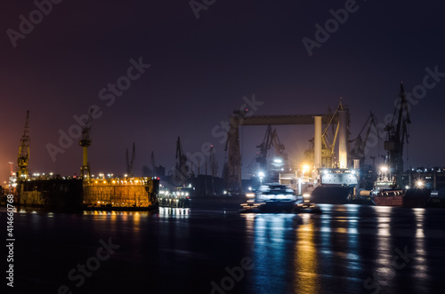 NIGHT IN SHIPYARD - Repair dock, ships and cranes on the quays 