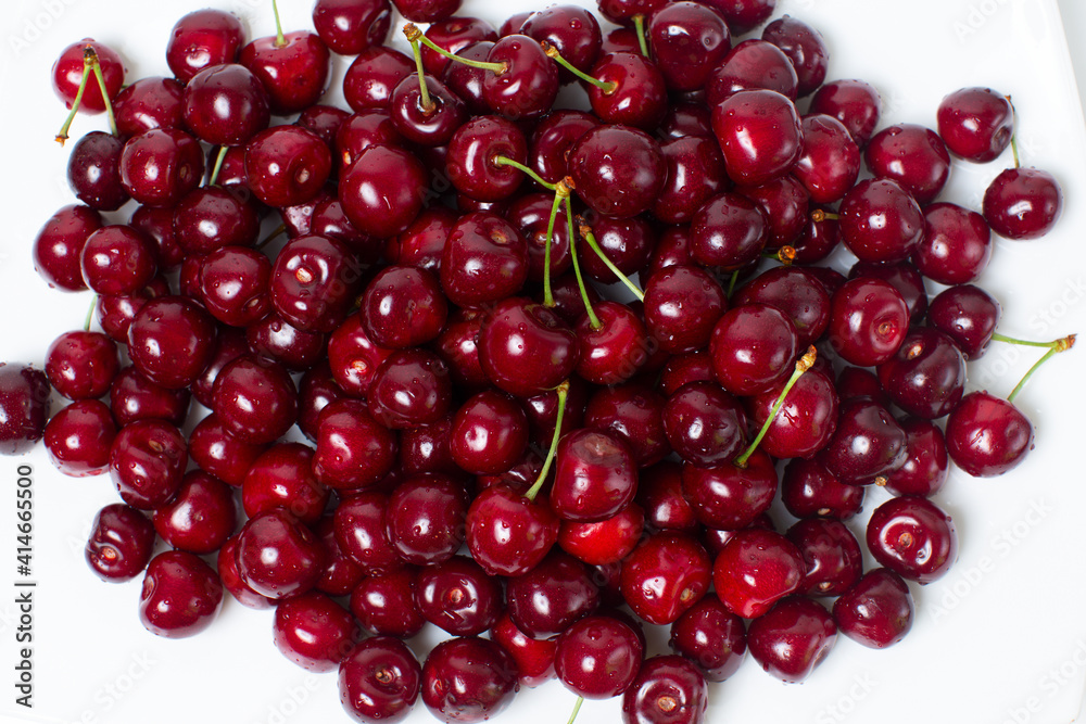 a full plate of juicy and ripe cherries. view from above a full plate of juicy and ripe cherries. view from above