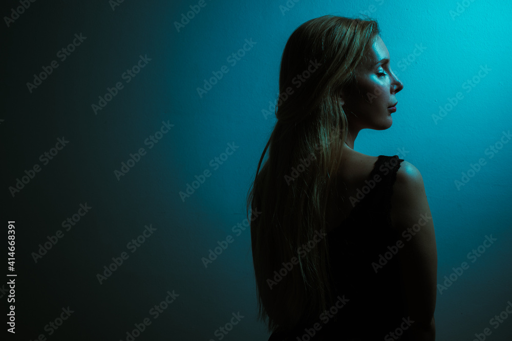 portrait of a woman with blue neon light