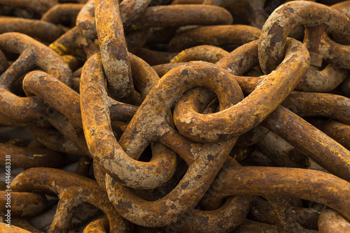 Large iron anchor chain. A rusty chain link. Corrosion. Shackles. © Evgeniy