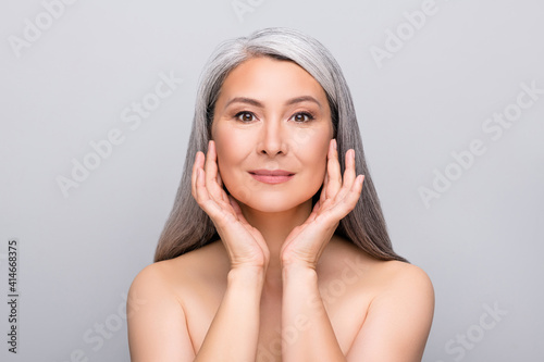 Photo of natural flawless retired pensioner senior lady hands touch sensitive perfect skin isolated grey background