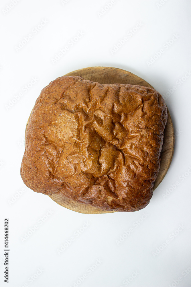 Black bread on a white background. Borodino bread. Homemade baking. Bakery product