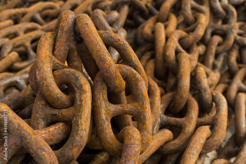 Large iron anchor chain. A rusty chain link. Corrosion. Shackles. © Evgeniy