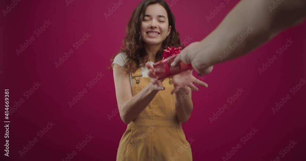 Young beautiful happy girl accepting presents Young beautiful happy girl accepting presents