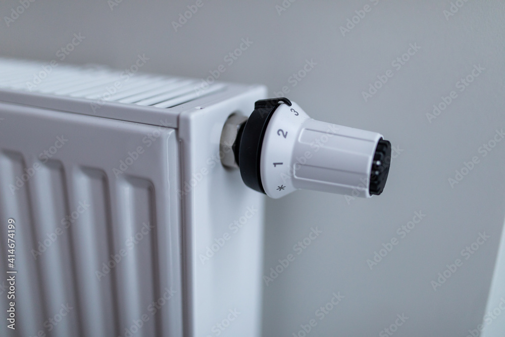 The battery is hanging on the wall. Heating in an apartment, at home. Heating prices. The battery is hanging on the wall. Heating in an apartment, at home. Heating prices.
