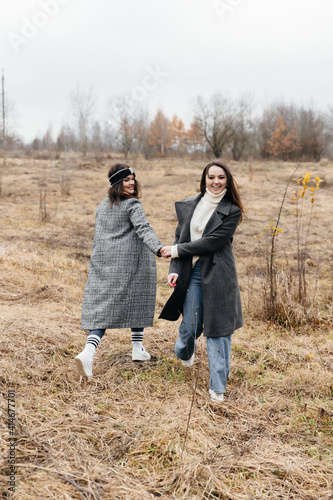 LGBT lesbian couple love moments happiness concept. A walk in nature