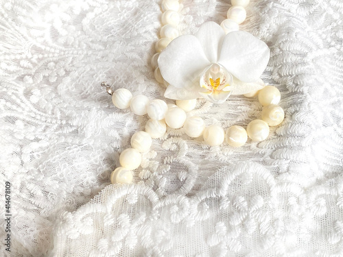 pearl necklace on white lace