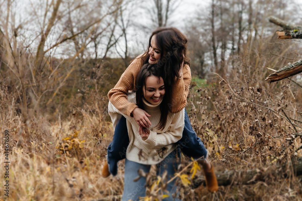 LGBT lesbian couple love moments happiness concept. A walk in nature LGBT lesbian couple love moments happiness concept. A walk in nature
