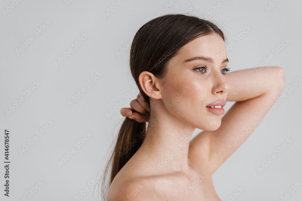 Beautiful shirtless girl posing and looking at camera Beautiful shirtless girl posing and looking at camera