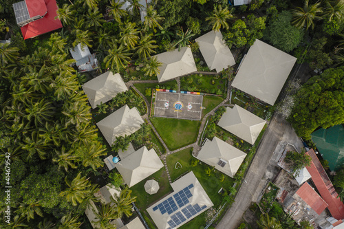 Amazing Drone Aerial Shot of an Orphange Small Community Village in the Philippines with a Vibrant Colorful Basketball Court