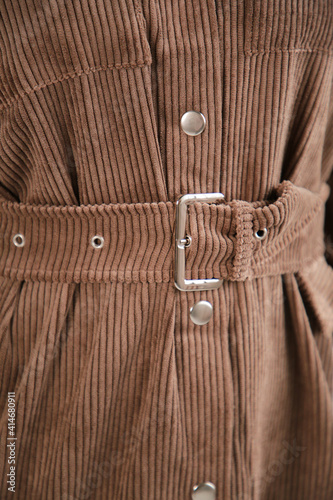 Detail dress. Brown dress belt close up. Top view