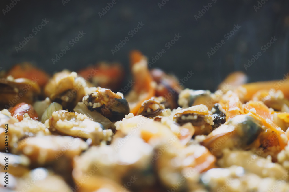 Cooking of traditional Moroccan couscous with mussels. Cooking of traditional Moroccan couscous with mussels.