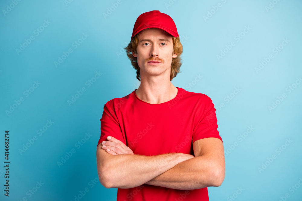 Portrait of working man folded arms content face look camera isolated on pastel blue color background Portrait of working man folded arms content face look camera isolated on pastel blue color background
