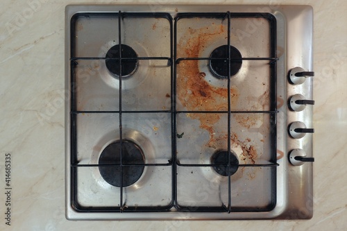 Dirty kitchen stove cooker needs cleaning up photo