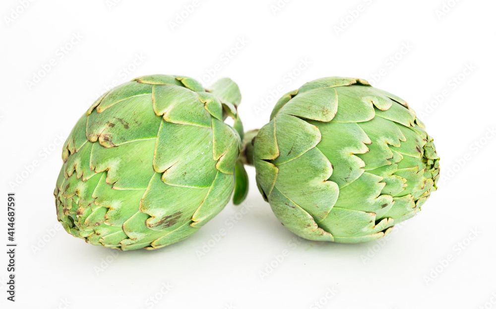 Fototapeta premium two ripe artichokes on white background