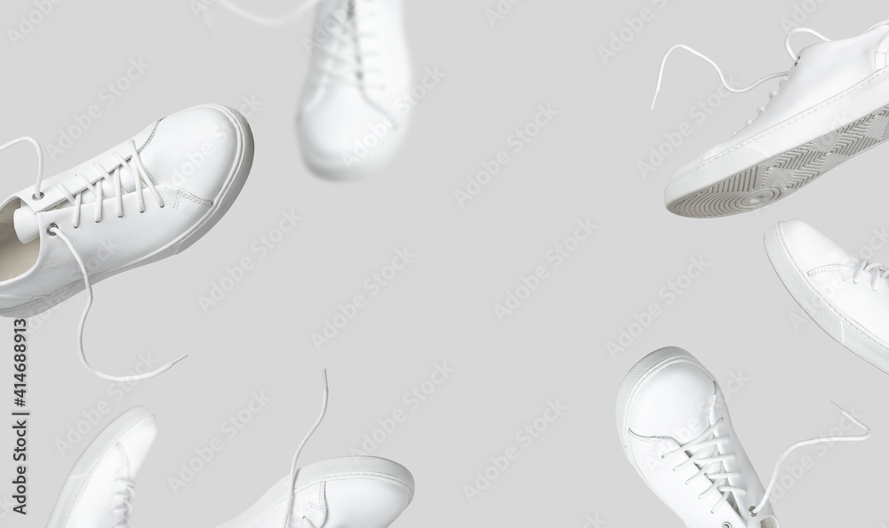 Flying white leather womens sneakers isolated on gray background, different  kind. Fashionable stylish sports casual shoes. Creative minimalistic layout  with footwear. Advertising for shoe store, blog Stock-Foto | Adobe Stock