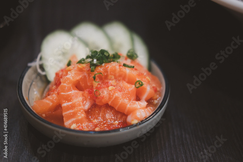 Spicy salmon salad in mini bowl