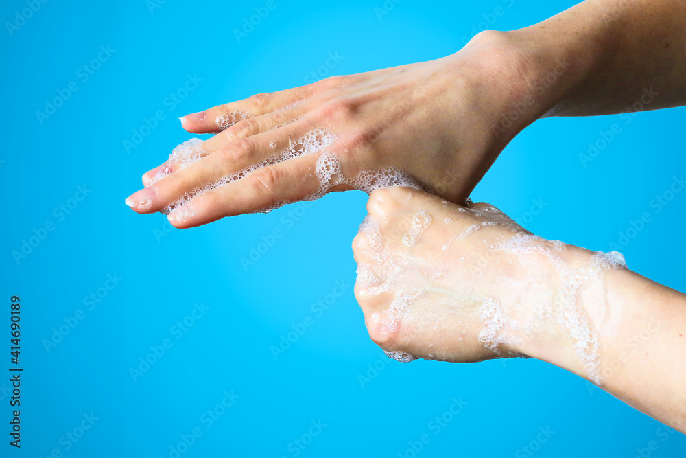 Fototapeta premium Cleanning hands with soap to prevent bacteria or viruses. Cleanliness and body care concept.