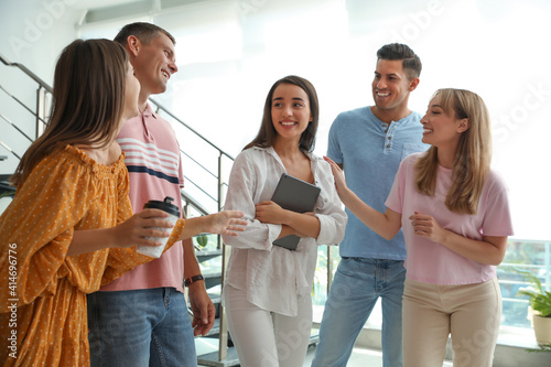Group of people having conversation in hall