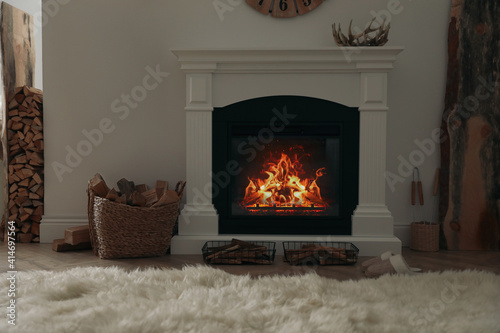 Firewood burning bright in elegant hearth indoors