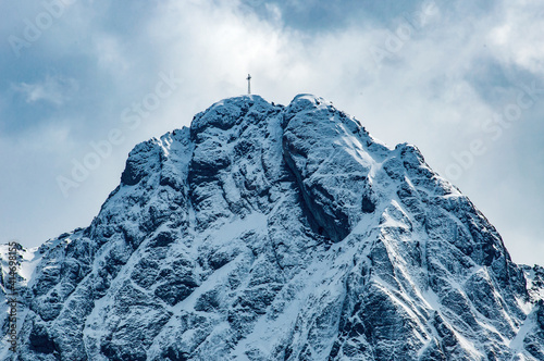 Giewont summit with a metal cross on the top in Tatra Mountains near Zakopane in Poland photo