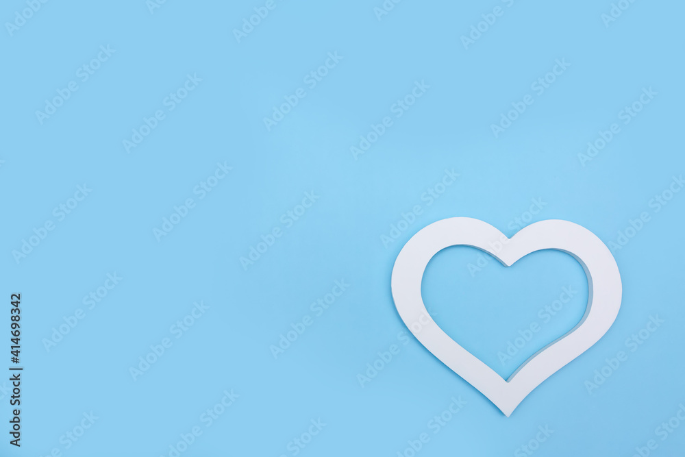 white heart on a blue background with room for text