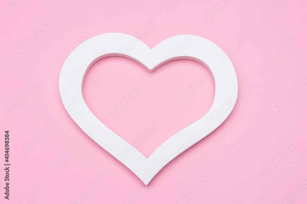 white heart on a pink background