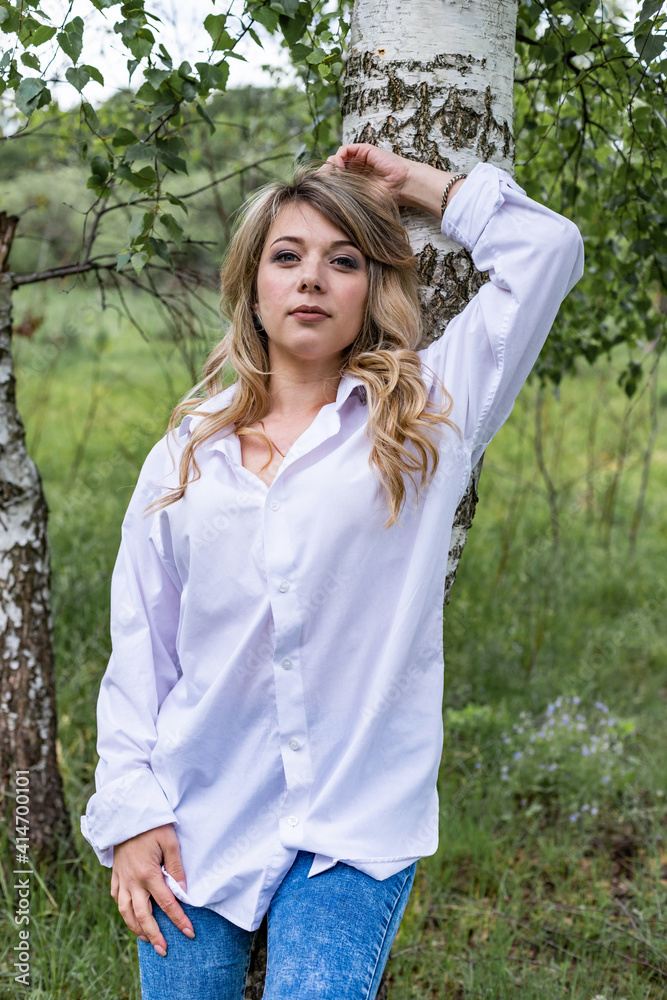 young woman near a tree
