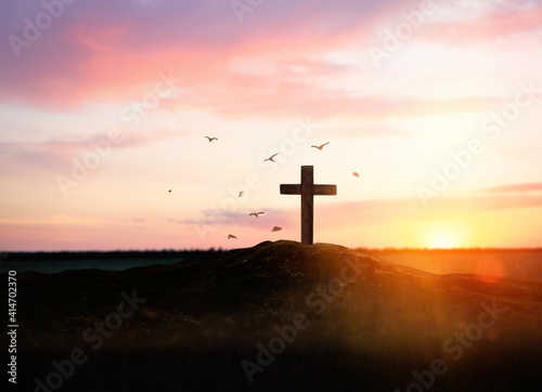 Christian cross on hill outdoors at sunset. Crucifixion Of Jesus
