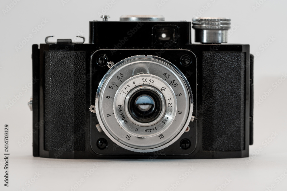 old camera in front view on white background