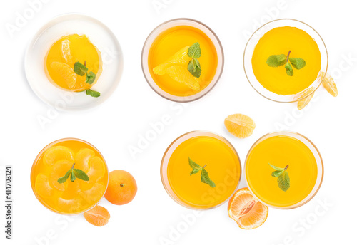 Set with delicious tangerine jelly on white background, top view
