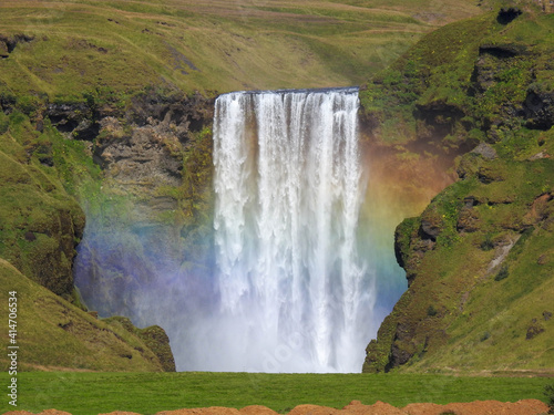 Skogafoss waterfall with  a rainbow in the mist in Iceland