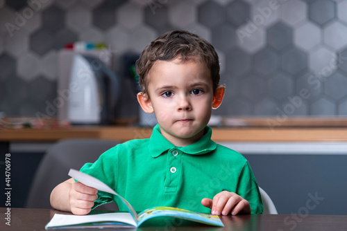 Sad boy with a book