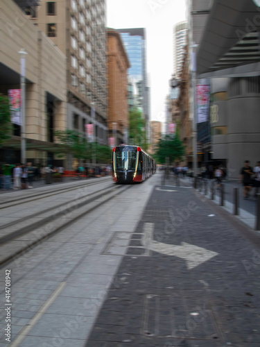 Tram moving through George St in Sydney NSW Australia